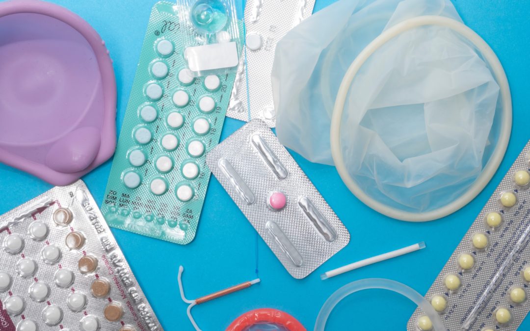 Reproductive health supplies over a blue background